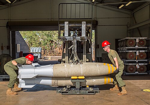 500px-USMC_airmen_load_bombs_onto_a_bomb_skid_at_RAAF_Base_Tindal_in_August_2016.jpg