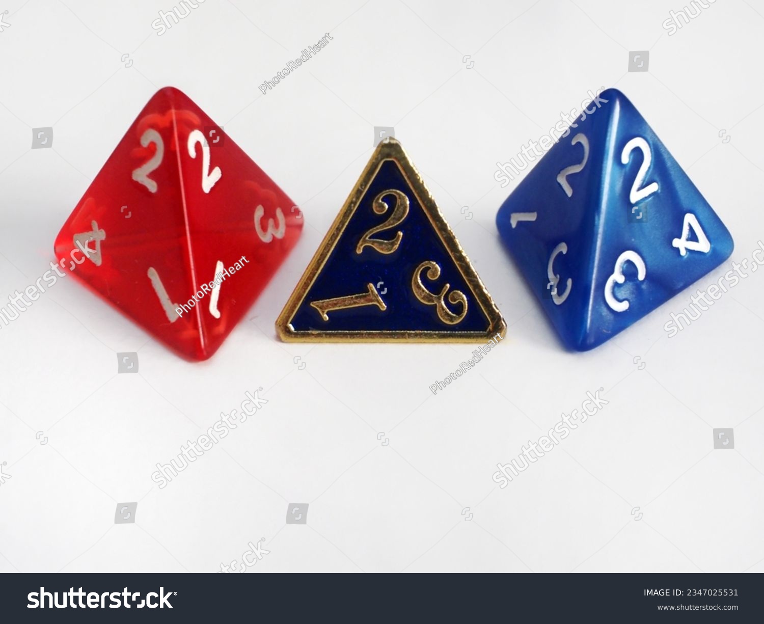stock-photo-three-four-sided-dice-rpg-dice-tetrahedron-dnd-dice-isolated-on-white-2347025531.jpg